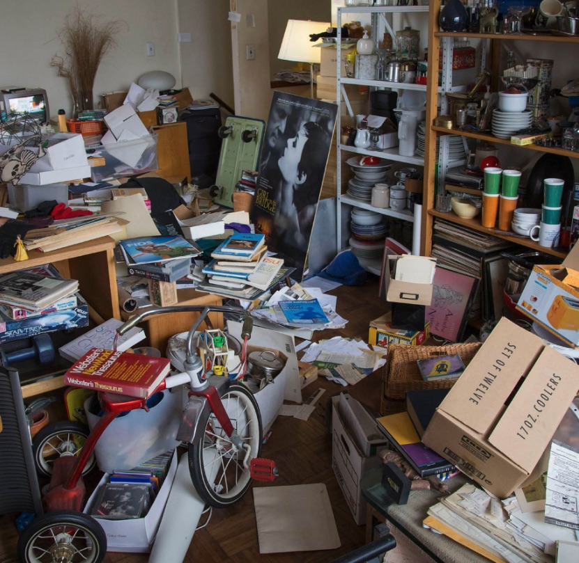 Collected books, dishes, records, and keepsakes in a crowded Farmington room